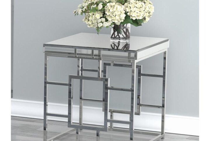 Accent your space with this modern end table. Showcase your flair for architecture with the geometric frame design. Brighten up any contemporary space with the mirrored tabletop. The metal frame is electroplated in a shiny chrome finish for the ultimate in sophistication. Piece pairs well with coffee table from same collection.