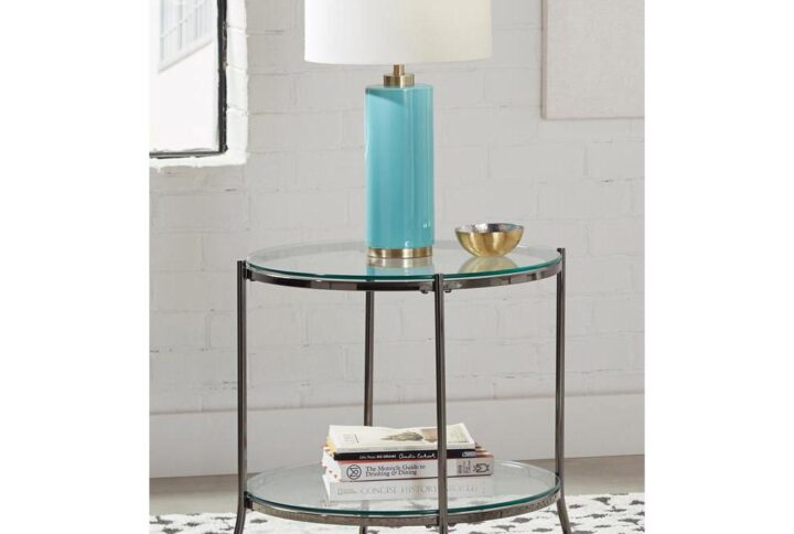 The sleek lines and open and airy design of this end table elevate and refine any seating area. Flanking a sofa or nestled beside an accent chair