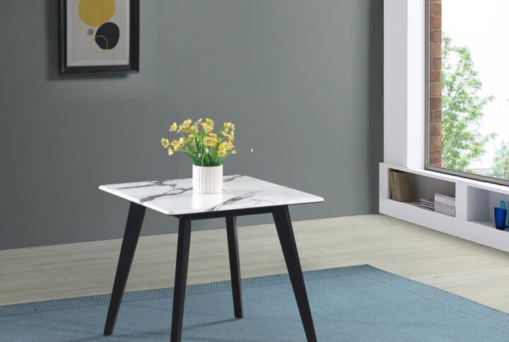 Complete a living room with a unique touch of character. This mid-century modern end table flaunts a bold