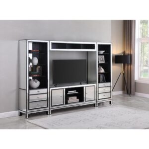 this piece makes an instant focal point. Two open shelving units offer a space to store media. Two side cabinets present even more opportunity to store and conceal items. This TV console can support up to a 60-inch TV.