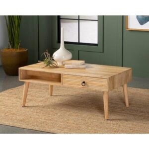 Boho-inspired elements and clean lined come together to create this refined transitional coffee table. Crafted from solid mango wood in a warm light hue and natural finish