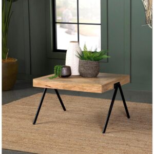 Place this farmhouse industrial coffee table in front of a sofa or loveseat for a rustic touch. Built using solid mango wood in its natural state