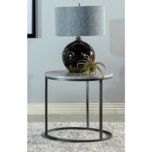 The perfect touch for contemporary spaces is this round end table. Entirely minimalist in design