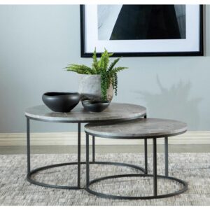 A nesting coffee table makes an interesting addition to your living space. Two round coffee tables join as one in a nesting fashion