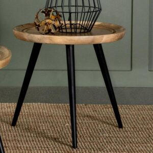 tapered legs that flare outward playfully toward the floor. Designed with a round tabletop made of solid mango wood