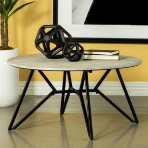 Gunmetal finish hairpin legs offer an industrial edginess to this modern coffee table. Designed with a faux cement top in an elegant round shape