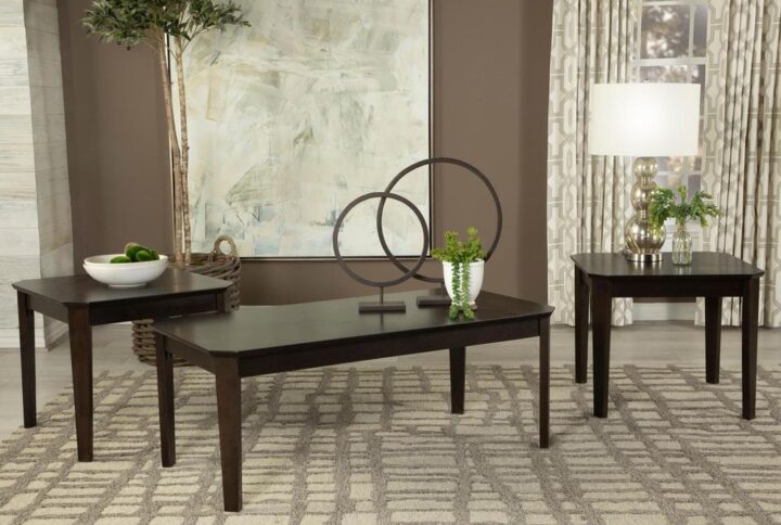 Casual style and simple lines enhance this three-piece occasional table set. Complete with a coffee table and two end tables