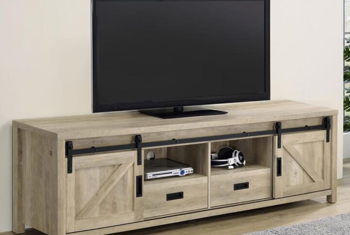 Wood-like finishes and country-inspired elements create this rustic style TV console. Keep entertainment consoles