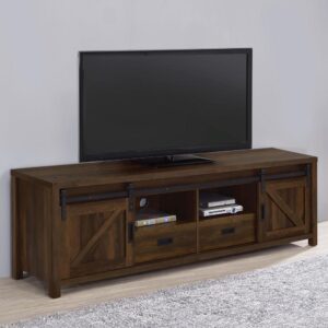 Wood-like finishes and country-inspired elements create this rustic style TV console. Keep entertainment consoles