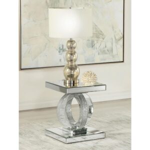This glamorous end table is a real showstopper. Designed entirely of polished mirror surfaces