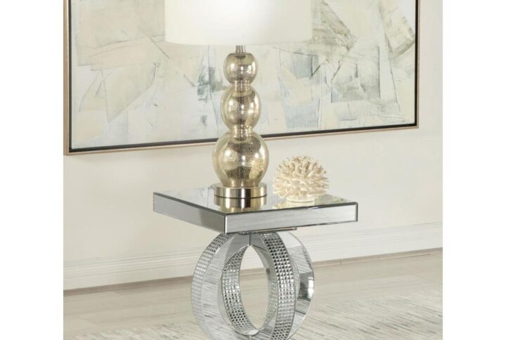 This glamorous end table is a real showstopper. Designed entirely of polished mirror surfaces