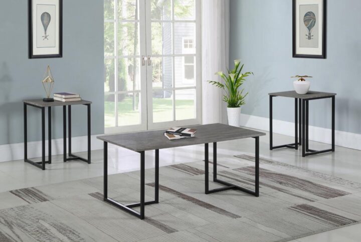 This three-piece table set was designed for both contemporary and transitional style living rooms. Complete with a coffee table and two end tables