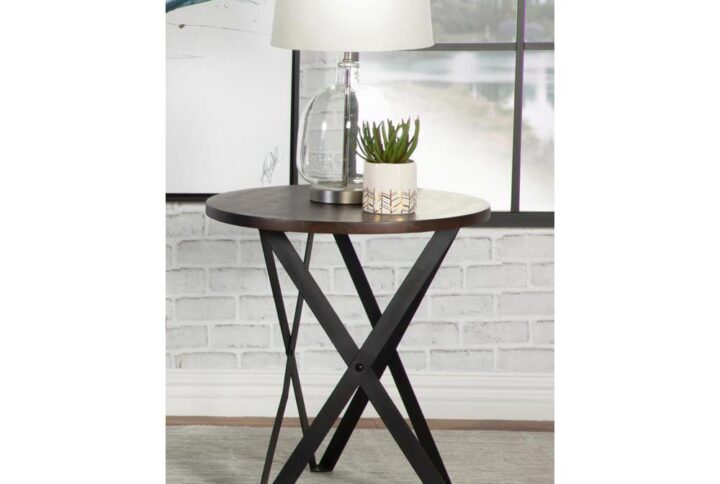 This end table offers a round acacia wood top in a warmly hued