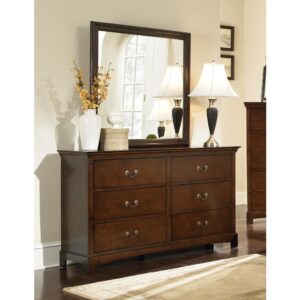 Rich color and sleek design make this six-drawer dresser a stunning addition to any bedroom. Crafted in a warm brown finish