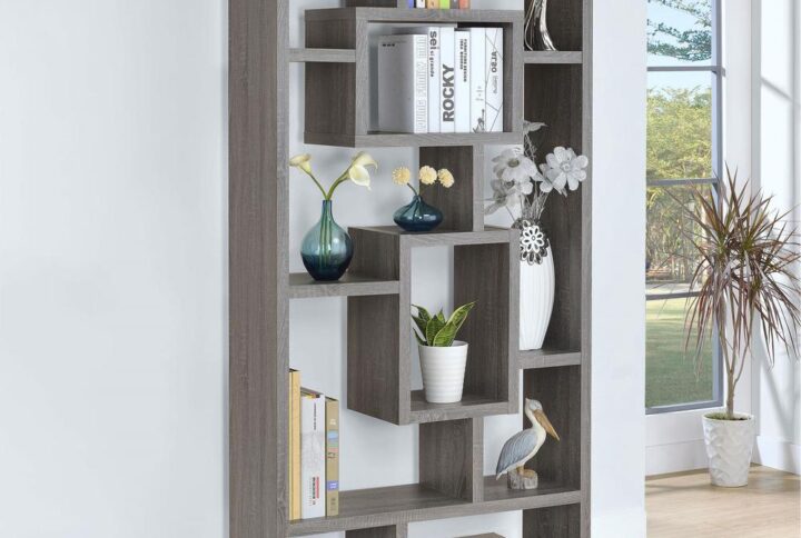 A whimsical silhouette captures attention as it offers essential space for display. This fun bookcase presents a puzzle-like profile with exceptional charm. Ten shelves in a variety of configurations provide plenty of room to show off decor and photographs