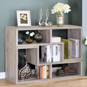 Bring a little geometric flair into your living space. This versatile bookcase easily turns on its side to create a stylish television console. The piece features multiple open cubbies perfect for showing off personal treasures. Alternately