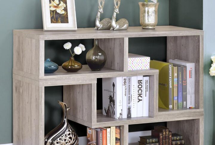 Bring a little geometric flair into your living space. This versatile bookcase easily turns on its side to create a stylish television console. The piece features multiple open cubbies perfect for showing off personal treasures. Alternately