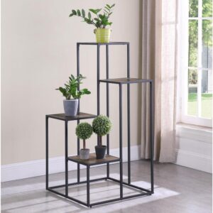 Make a statement with a tiered shelving unit. Four open shelves create the perfect place for displaying your favorite decor items. Its industrial design is enhanced with a black metal frame. Meanwhile