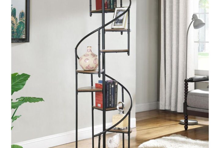 A unique black bookcase in a spiral design is sure to make your heart sing. Eight open shelves cascade down the frame of this rustic and industrial piece. The frame is crafted from metal with a black finish. The triangular shelves are finished in a warm wood color for contrast. Instantly enhance living areas and offices with this black rustic bookcase.