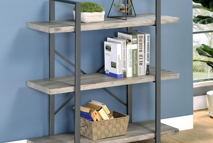 An exceptional style rustic bookcase will soon improve your living area or office. A sturdy geometric frame provides an open and airy feel. Three roomy shelves with thick construction provide a sturdy place to display your favorite books. The cross back design provides additional support and aesthetic flair. This piece is constructed from materials such as steel and engineered veneer.