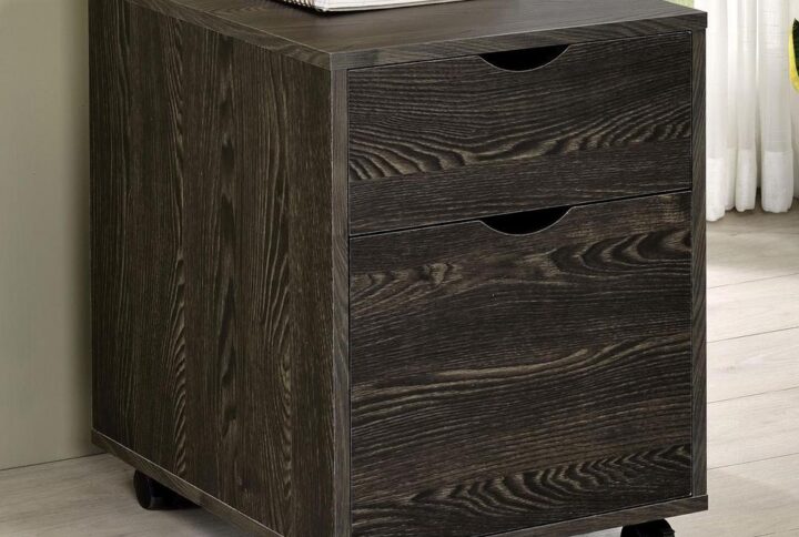 Pair this filing cabinet with a matching writing desk to give yourself extra storage space. Designed with a dark oak finish throughout