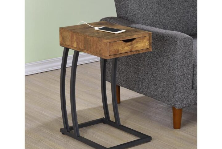 Designed for convenience and styled for optics. This accent table blends the best of architecture and earthy ambiance. Antique nutmeg finish wood offers a rustic look in a tabletop unit with storage drawers. Blended with a sleek dark metal frame