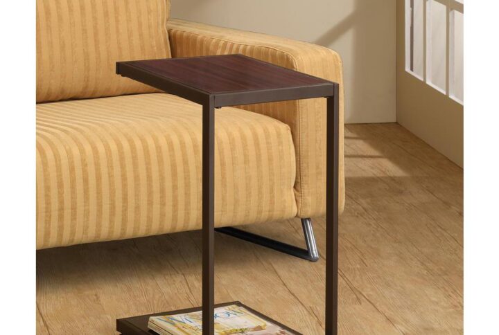 Make it easy to relax and enjoy entertainment without leaving the sofa. This snack table offers a handy way to serve while visiting and watching television. An angular shape delivers service on its top try and a bottom base that slides beneath a sofa or chair to provide easy access. Versatile dark brown offers a tasteful finish over a faux wood top