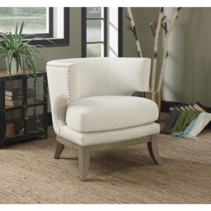 This thick-cushioned accent armchair is a highlight of any room. Featuring a barrel back and high armrests