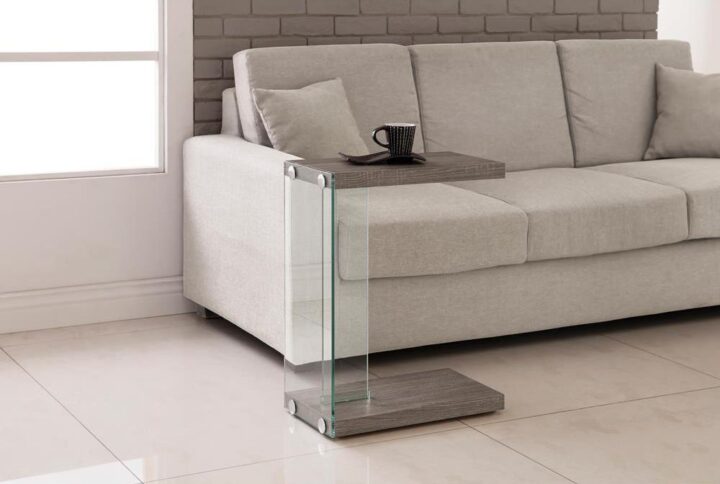 Add subtle elegance and maximum functionality to a living room with this weathered grey accent table. Also available in black and grey