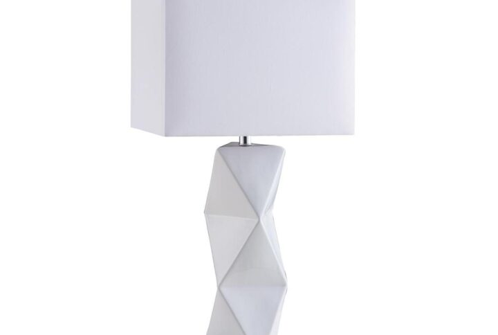 This table lamp has a contemporary design that's ideal for the modern-furnished home. The ceramic base/stand comes in a stunning white geometric design that adds a touch of elegant panache. The lamp is topped with a white rectangular shade to complete the look. Choose the appropriate level of lighting with the convenient 2-way switch. This lamp looks great in a geometric-inspired den or living room.