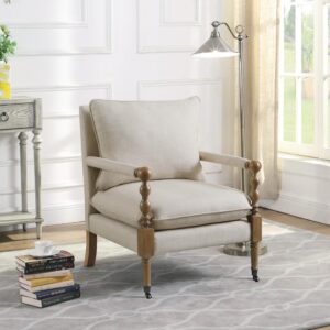 Introduce stylish comfort to a master suite or living room seating area. This upholstered accent chair features wonderful linen-line fabric that elevates its inviting style to new heights. Exposed wood framing in a dark oak finish draws the eye and offers a touch of contrast. The chair features a plush seat and back pillow