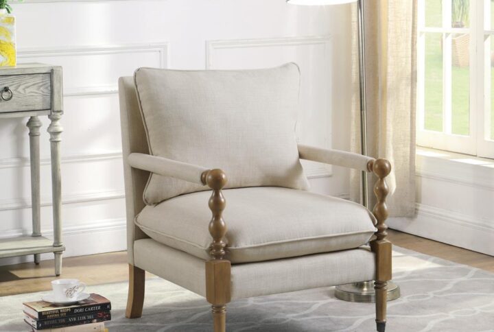 Introduce stylish comfort to a master suite or living room seating area. This upholstered accent chair features wonderful linen-line fabric that elevates its inviting style to new heights. Exposed wood framing in a dark oak finish draws the eye and offers a touch of contrast. The chair features a plush seat and back pillow