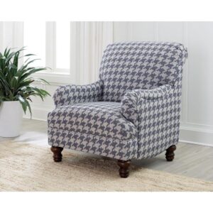 A standout houndstooth check pattern draws due attention to this fashionable accent chair. With tailored English arms and turned legs offering a contrasting espresso finish