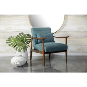 Soft upholstery and natural elements combine to create a striking accent chair. Its teal color gives it an interesting aesthetic vibe with cashmere-like upholstery. The natural wood frame of this armchair enhances the teal fabric. A matching supportive pillow comes included for additional support. This accent chair can easily enhance eclectic living spaces with a mid-century modern design.