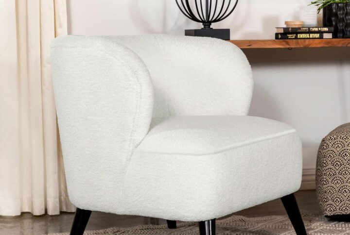 Lend a retro-inspired chic modern aesthetic to seating area and corner nooks with this contemporary accent chair. Designed with a deep barrel style seat with a traditional wingback design