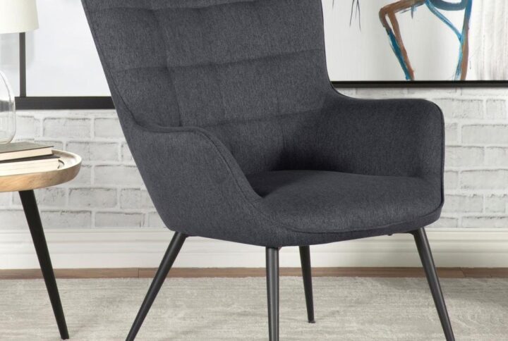 This eye-catching mid-century modern accent chair offers up a vintage vibe with its contoured design and slim legs. A biscuit tufted backrest offers modern take on the classic wingback design with flared corners. Narrow