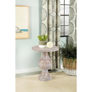 this modern accent table offers a stylish blend of art and sophistication. A pedestal design doubles down on elegance and creates an eye-catching look. Infuse romantic charm to a living space or entryway with a table featuring a shapely frame and round top. Crafted of eco-friendly mango wood