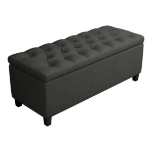 comfort and convenience. This grey storage bench features a tufted top that conceals an expansive storage area inside. The top is comfortably cushioned to provide extra seating space. Elegant button tufting adds chic