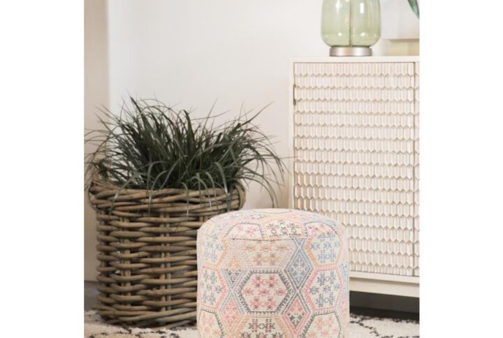Bohemian flair is brought to life with this attractive accent stool. Light pastel colors collide to create an interesting quilt-like design on the fabric. This accent stool is upholstered in woven cotton for softness and subtle texture. Supported on tapered wood legs