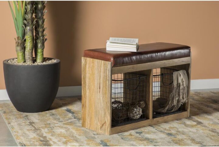 Storage and style are at your service with this attractive brown accent bench. The natural wood grain finish makes this a versatile piece in your home. Two storage compartments allow you to store small items within. Take a seat on the padded seating to put on your shoes or take a breather. This piece is supported on a platform base.