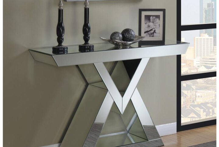Create a breathtaking visual in an entryway with this stunningly modern console table. In a bright silver finish