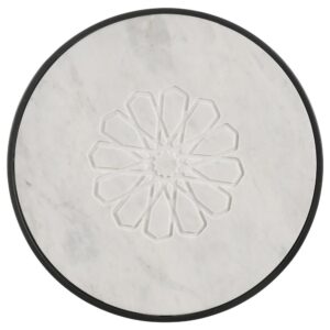the table features a round top crafted of white marble for a luxe look and feel. Carved in the top