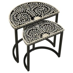 Artisan and exotic describes this elegant nesting table set with two tables that bring pure style to any living space. The Zakiya two-piece nesting table set conquers your serving needs while adding a bold and exquisite aesthetic. Set up a living room to entertain in full with these tables that feature gorgeous crafting with black finished iron forming clean lines and a semi-circle base to each table. The ornate detail of a black and bone inlay half-moon tabletop stands out to be noticed with a busy yet nature-inspired pattern. Set these tables apart as separates or close together for a larger serving space