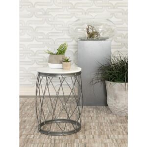 This drum shape accent table serves up contemporary vibes and an open