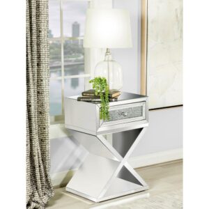 Shimmering accents and polished elements come together in this glam accent cabinet. Covered entirely in clear mirror surfaces and beveled mirror trim and tile