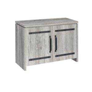 classic design that's timeless. Two doors with contrasting dark hardware and nailhead accents give the cabinet a contemporary appearance. The doors open for easy access to ample storage space. It's finished in grey driftwood that's well suit for a living room or den with plenty of light.