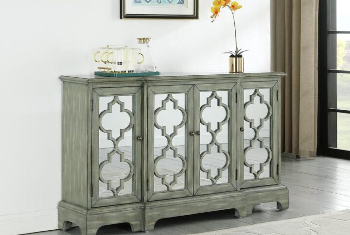 Complete a living or dining room with the decorative pattern on the front of this modern accent cabinet. The legs and geometric shapes dazzle in a weathered grey finish. Subtle hue variations and an exposed wood grain marry to add depth. An upgrade to the classic sideboard