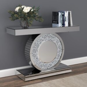 Glam up your living space with this contemporary console table. This silver finish console table has a mirrored effect for a punch of contemporary glam. The geometric design displays a disc body framed by a rectangular base and tabletop for a sculptural aesthetic. Silver accent crystals provide textural dimension to the circular body. This contemporary console table works well in a space with a Hollywood glam theme.