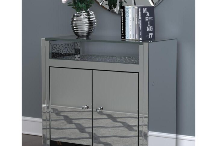 Accent a contemporary dining room or entertainment space with this silver accent cabinet. The crisp linear design lends a modern silhouette