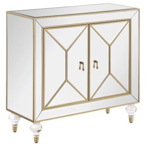 This glamorous accent cabinet lends an air of sophistication and elegance with its polished mirror surfaces and champagne accents. With an inverted beveled design along each of the dual cabinet doors